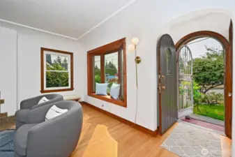 Cute entry with arched door and doorway welcome you as you enter the home,