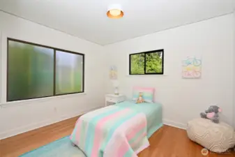 and mid-sized second bedroom features privacy window to side yard deck.