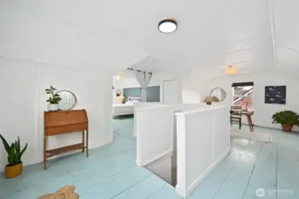 the open upper level has a generous ceiling height and is trimmed and finished.