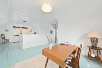 featuring a small sitting area in the first bay at the top of the stairs,