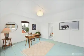 and an office area or future bedroom in a second bay