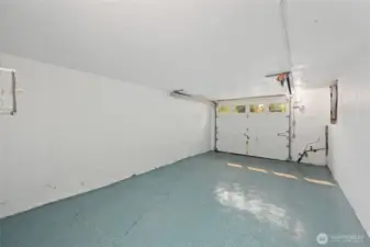 Clean garage with natural light through transom windows.