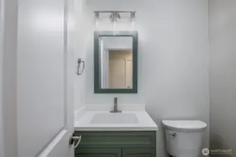 Half Bathroom with new lighting and mirrors