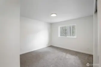 Bedroom #1 with new glass in windows & carpeting