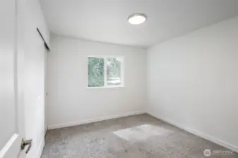 Bedroom #2 with new glass in windows & carpeting