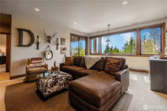 Downstairs family room/rec room with beverage fridge.