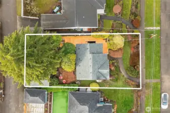 Street to alley lot with convenient garage access and additional parking space behind the garage