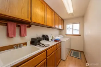 Laundry room with storage.