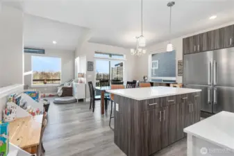 Kitchen looking on to dining and living rooms.