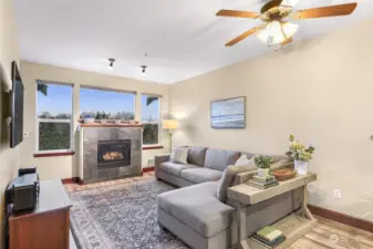 The living room features a natural gas fireplace and access to a west-facing balcony (catch those sunsets!)