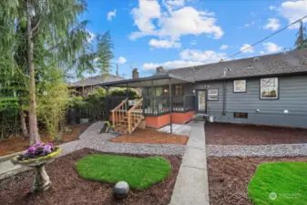 View from back garage of yard and covered deck.