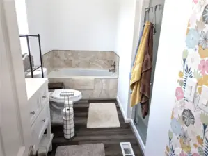 Primary bath with jetted tub & separate shower.
