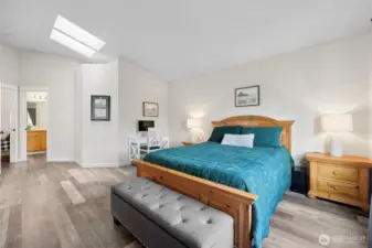 Vaulted skylights in primary bedroom also provide an abundance of natural light.