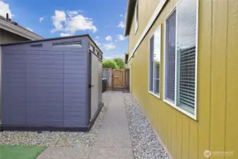 Large shed stays with the home! Gate to front yard for easy access.