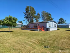 Front of home with large wrap around deck