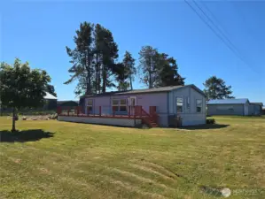 Front of home with large wrap around deck