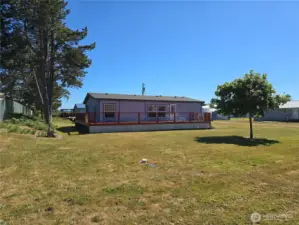 Front of home with large wrap around deck