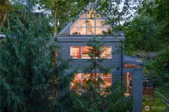 Enjoy dramatic architecture and soaring ceilings in this striking Northwest modern home.