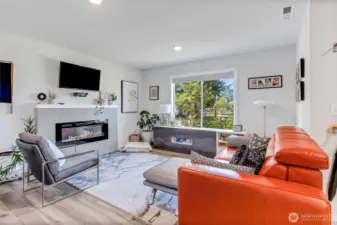 Electric fireplace and view of Long Lake from living room