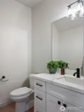 Powder Room has quarts counter and undermount sink.