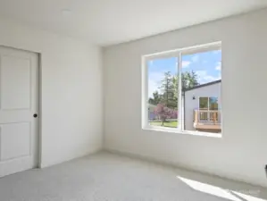 One of 4 bedrooms with upgraded carpet and pad.
