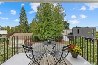 Your very own private primary suite balcony is the perfect spot to take in golden Olympic Mountain sunsets and partial views of the City of Bellevue.