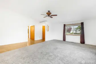 From the living room, looking back toward the front door, you'll see a large closet in the hallway that leads to the bedrooms.