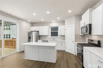 Gourmet kitchen with gas range. 10'x12' deck off kitchen