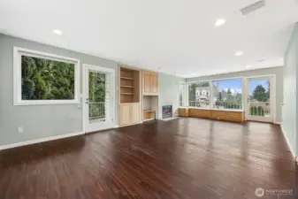 Family room next to kitchen with gas fireplace
