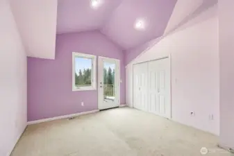 Middle upstairs room with exterior door to top deck. View of Mt. Rainier