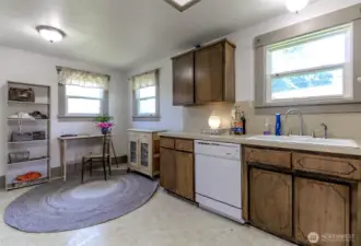 There is a dining area in the kitchen which is currently used for office space