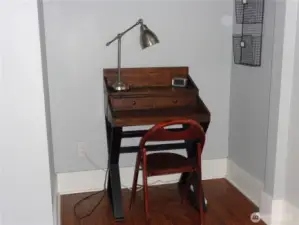 sitting area w/desk in main suite
