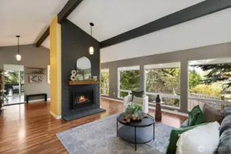 Gas fireplace between the dining & living spaces. Looking onto the kitchen.