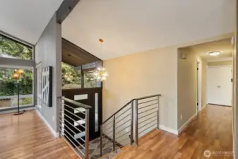 Living room to your left, 3 bedrooms down the hall and dining/kitchen to your right.