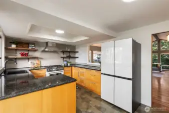 Renovated kitchen with newer appliances & granite countertops.