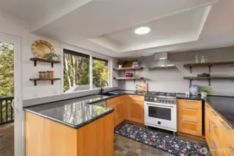 Renovated kitchen with newer appliances & granite countertops.