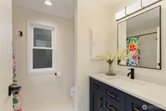 Shared refreshed, full bath on main level.