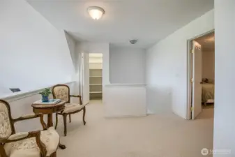 loft sitting area, storage and primary to the right