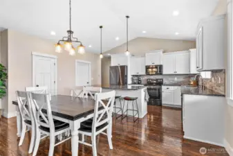 Large walk-in pantry through door on left, utility room with bench & storage on right