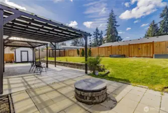Spacious covered patio view with fire pit