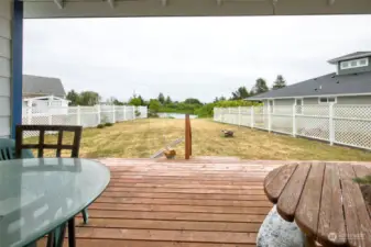 Covered back porch, looking at the waterfront.