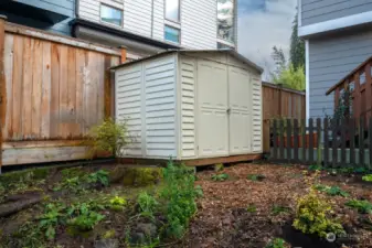 Work shed for tools and outdoor furniture storage.