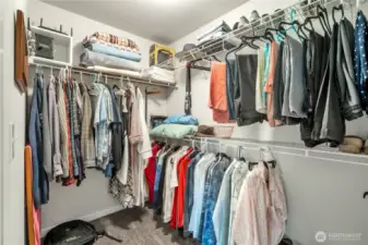 Walk-in closet in primary bedroom.