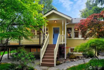 Welcome to Rose Cottage at 7505 32nd Ave SW. An iconic property with a thoughtfully curated secret garden.