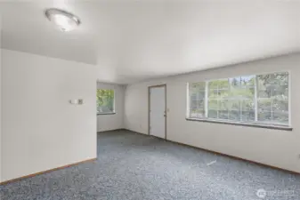 Unit B includes this spacious living room with great light and outlook.