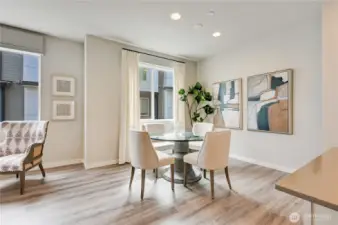 Dining Area - Notice the Large Windows and Engineered Hardwood Floors