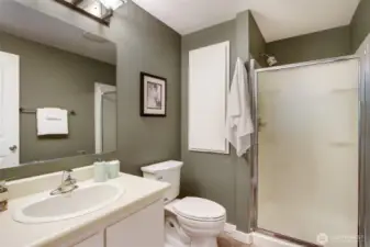Primary Bath is connected to the bedroom, for privacy and convenience. The cream and evergreen color palette bring the outside in...