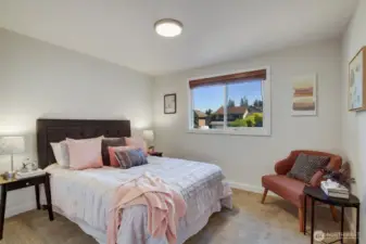 Bedroom 2 of three. The upgraded vinyl windows with wood blinds make the room light and bright or private and shaded. Same fresh paint and new carpet as the other two bedrooms.