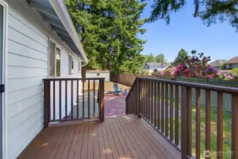 This deck is fresh and easy. Maybe the BBQ stays up here, close to the kitchen? The lower patio is ready for larger groups of friends, table, chairs, maybe a fire feature?