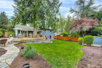 Deck and patio, perfect for entertaining.  Stone path to firepit.